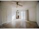 Bedroom with ceiling fan and sliding glass door to backyard at 1111 E Village Circle N Dr, Phoenix, AZ 85022