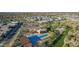 Stunning aerial shot features a community pool and clubhouse, surrounded by homes, trees and desert landscaping at 1115 E Mcneil St, Phoenix, AZ 85042