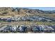 Aerial view of a community with contemporary homes against a mountain backdrop at 1115 E Mcneil St, Phoenix, AZ 85042