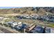 An aerial view of neighborhood with modern homes featuring solar panels, set against a mountainous backdrop at 1115 E Mcneil St, Phoenix, AZ 85042