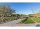 Picturesque view of the landscaped community park area, featuring walking paths and shaded seating pavilions at 1115 E Mcneil St, Phoenix, AZ 85042