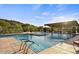 Inviting community pool area featuring desert views, shade structure, and comfortable lounge seating at 1115 E Mcneil St, Phoenix, AZ 85042