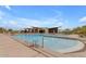 Community pool area features lounge chairs, cabana, and stunning views of the desert landscape at 1115 E Mcneil St, Phoenix, AZ 85042