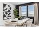 Modern dining room featuring a beige table with seating for six, monochrome artwork and neutral decor at 1115 E Mcneil St, Phoenix, AZ 85042