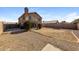 Expansive backyard featuring gravel landscaping, privacy fence, and a balcony overlooking the outdoor space at 11328 N 89Th Dr, Peoria, AZ 85345