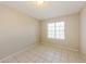 Bedroom with tile flooring and one window for natural light at 11328 N 89Th Dr, Peoria, AZ 85345