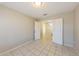 Bedroom with tile flooring and doorway to stairs at 11328 N 89Th Dr, Peoria, AZ 85345