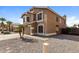 Two-story home featuring a two car garage and desert landscaping at 11328 N 89Th Dr, Peoria, AZ 85345