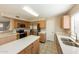 Bright kitchen features stainless steel appliances, an island and modern countertop at 11328 N 89Th Dr, Peoria, AZ 85345