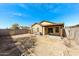 Large backyard with covered patio, mature landscaping and block wall at 11609 W Corrine Dr, El Mirage, AZ 85335