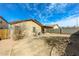 Spacious backyard featuring a covered patio and block wall providing privacy at 11609 W Corrine Dr, El Mirage, AZ 85335