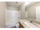 Well-lit bathroom featuring a shower-tub combination, granite countertop, and a modern sink at 11609 W Corrine Dr, El Mirage, AZ 85335