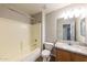 Clean bathroom featuring a granite countertop, a modern sink, and a bathtub with shower at 11609 W Corrine Dr, El Mirage, AZ 85335