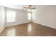 Bright bedroom featuring tile floors, neutral walls, and natural light from the windows at 11609 W Corrine Dr, El Mirage, AZ 85335