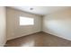 A bedroom with tile flooring and a window offering plenty of light at 11609 W Corrine Dr, El Mirage, AZ 85335