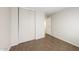 Bedroom featuring tile flooring, closet, and an entry to another room at 11609 W Corrine Dr, El Mirage, AZ 85335