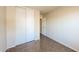 Neutral bedroom with tile flooring, closet, and neutral paint at 11609 W Corrine Dr, El Mirage, AZ 85335