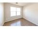 This bedroom is bright and airy, with a window for natural light and tile flooring at 11609 W Corrine Dr, El Mirage, AZ 85335