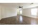 Inviting living area with tile floors, neutral paint, and a ceiling fan for comfortable living at 11609 W Corrine Dr, El Mirage, AZ 85335