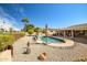 Backyard oasis with a pool, desert landscape, and golf course views at 12530 W Skylark Dr, Sun City West, AZ 85375