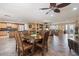 Open-concept dining room features a kitchen and a dining table with seating for eight at 12530 W Skylark Dr, Sun City West, AZ 85375