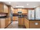 Well-lit kitchen featuring stainless steel appliances, granite countertops and ample cabinet space at 12530 W Skylark Dr, Sun City West, AZ 85375