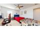 Well-lit bedroom with game table, red gaming chair and comfortable bed at 14420 W Faye Way, Surprise, AZ 85387