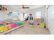 Bright bedroom featuring rainbow decor, a ceiling fan and play kitchen at 14420 W Faye Way, Surprise, AZ 85387