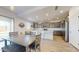 Bright kitchen with stainless steel appliances, quartz countertop island, and gray cabinetry at 14420 W Faye Way, Surprise, AZ 85387