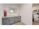 Functional laundry room with grey cabinetry, ample counter space, and convenient storage options at 14420 W Faye Way, Surprise, AZ 85387