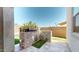 Modern outdoor kitchen with stone surround, stainless steel grill, and ample counter space at 14420 W Faye Way, Surprise, AZ 85387