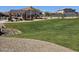 Community playground area with covered seating, play equipment, and green grass at 14420 W Faye Way, Surprise, AZ 85387