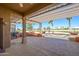 Expansive back patio with pergola, golf course view and hot tub area, perfect for outdoor enjoyment at 14432 W Robertson Dr, Sun City West, AZ 85375