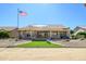 Inviting backyard retreat with manicured landscaping, artificial turf, hot tub and covered patio area at 14432 W Robertson Dr, Sun City West, AZ 85375