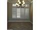 Dining room featuring natural light, a chandelier, and plantation shutters at 14432 W Robertson Dr, Sun City West, AZ 85375