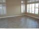 Bright living room featuring plantation shutters and neutral color palette at 14432 W Robertson Dr, Sun City West, AZ 85375