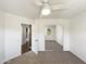 Bright bedroom with mirrored closet doors, ceiling fan and neutral carpet at 14645 S 25Th Pl, Phoenix, AZ 85048