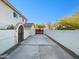 Long private driveway with a security gate leading to the main house at 14645 S 25Th Pl, Phoenix, AZ 85048