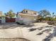 Two-story home featuring a three-car garage, desert landscaping and a long driveway at 14645 S 25Th Pl, Phoenix, AZ 85048