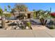 Charming home showcasing a beautiful desert landscape design with various cacti and mature trees at 14645 S 25Th Pl, Phoenix, AZ 85048