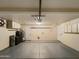 Spacious garage featuring built-in cabinets for storage and updated mechanical systems at 14645 S 25Th Pl, Phoenix, AZ 85048