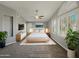 Serene main bedroom with neutral tones, plantation shutters, a ceiling fan and a king-size bed at 14645 S 25Th Pl, Phoenix, AZ 85048