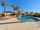 Inviting pool area with a gazebo, lush tropical landscaping, and a tranquil water feature at 14645 S 25Th Pl, Phoenix, AZ 85048