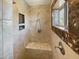 Shower showcasing tile surround, a corner seat and a shower niche at 14645 S 25Th Pl, Phoenix, AZ 85048