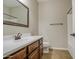 Bathroom with a single sink vanity, toilet, and a shower/tub combo with a white shower surround at 1541 W Crape Rd, San Tan Valley, AZ 85140