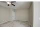 Clean bedroom featuring neutral carpeting, ceiling fan, and natural lighting at 1541 W Crape Rd, San Tan Valley, AZ 85140