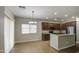 Open kitchen featuring granite countertops, stainless steel appliances, and dark wood cabinetry at 1541 W Crape Rd, San Tan Valley, AZ 85140