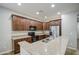 Beautiful kitchen featuring dark wood cabinets and granite countertops at 1541 W Crape Rd, San Tan Valley, AZ 85140