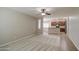 Comfortable living room with plush carpeting and an open layout to the kitchen area at 1541 W Crape Rd, San Tan Valley, AZ 85140