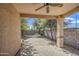 A covered patio featuring pavers on the ground and a view of the backyard and trees at 1541 W Crape Rd, San Tan Valley, AZ 85140